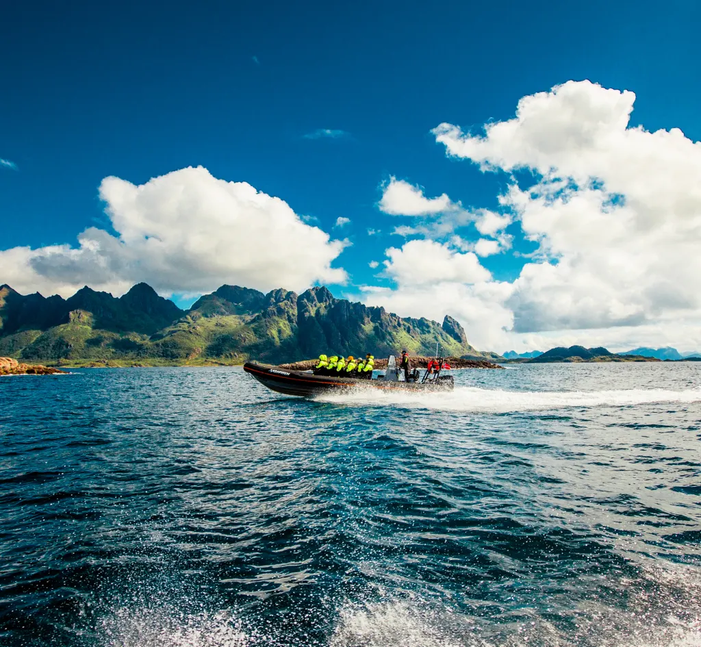 RIB boat from XXlofoten driving fast on the coast of Svolvær
